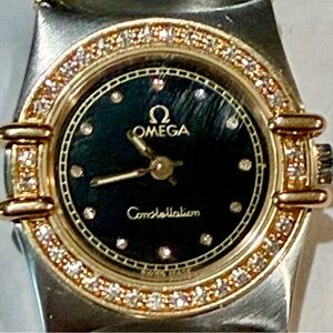 Omega Constellation with Black Dial and Gold Detailing with diamond bezel